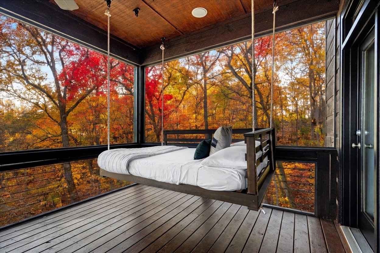 Hanging bed surrounded by fall foliage